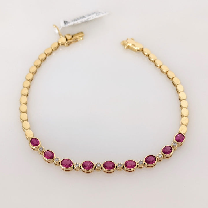 14K RUBY OVAL 3X4 (9) WITH .12 DIAMOND TOTAL WEIGHT ESTATE BRACELET 8.0 GRAMS