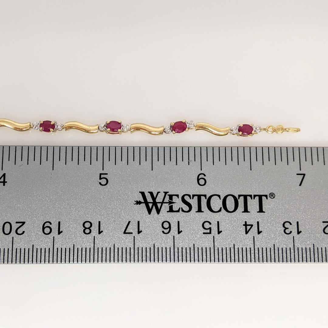 10K RUBY OVAL (9) 3X4 WITH (2) MELEE ESTATE BRACELET 3.5 GRAMS