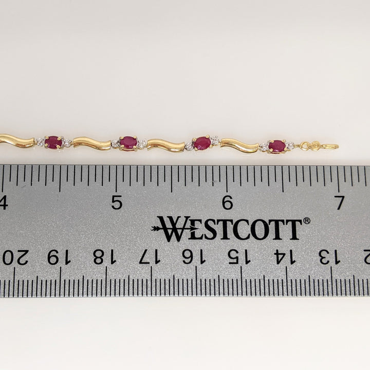 10K RUBY OVAL (9) 3X4 WITH (2) MELEE ESTATE BRACELET 3.5 GRAMS
