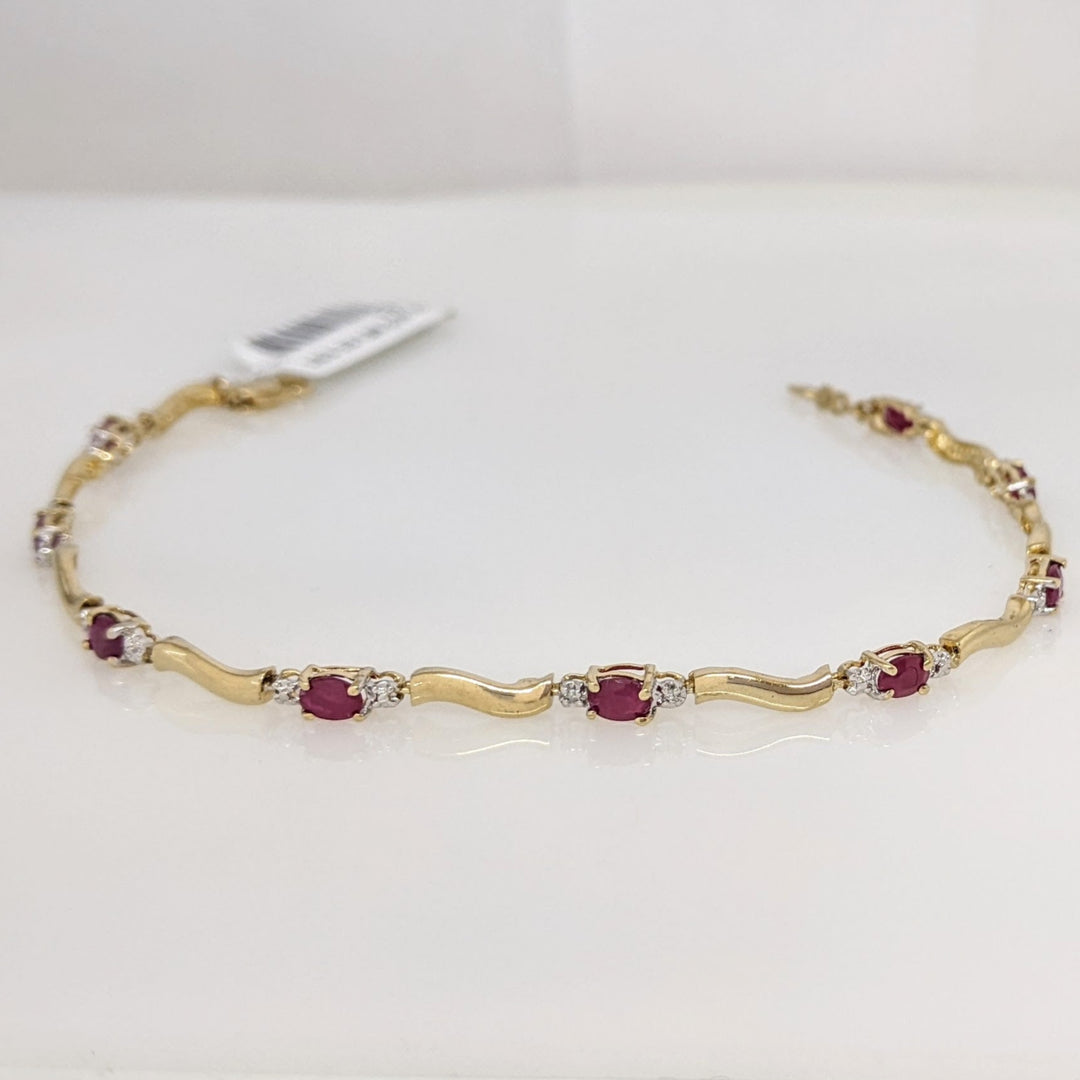 10K RUBY OVAL (9) 3X4 WITH (2) MELEE ESTATE BRACELET 3.5 GRAMS