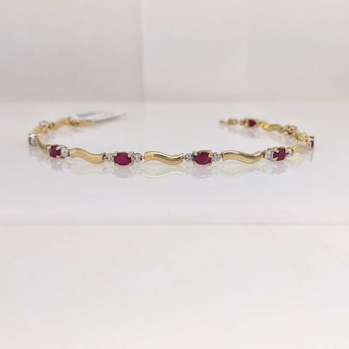 10K RUBY OVAL (9) 3X4 WITH (2) MELEE ESTATE BRACELET 3.5 GRAMS