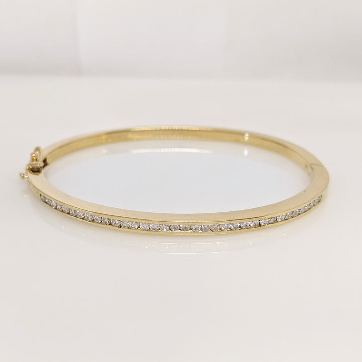 14K .70 CARAT TOTAL WEIGHT I1 I DIAMOND ROUND (35) CHANNEL SET ESTATE BANGLE 15.8 GRAMS