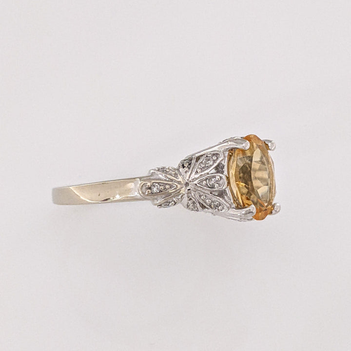 10K WHITE CITRINE OVAL 7X9 WITH MELEE ESTATE RING 3.8 GRAMS