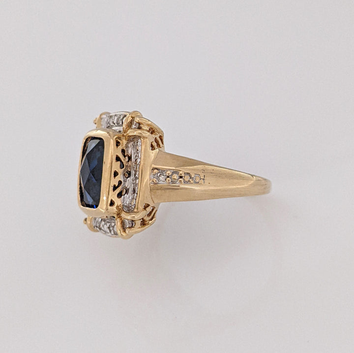 10K LAB-CREATED SAPPHIRE EMERALD CUT 6.5X8.5 WITH .16 DIAMOND TOTAL WEIGHT ESTATE RING 5.2 GRAMS