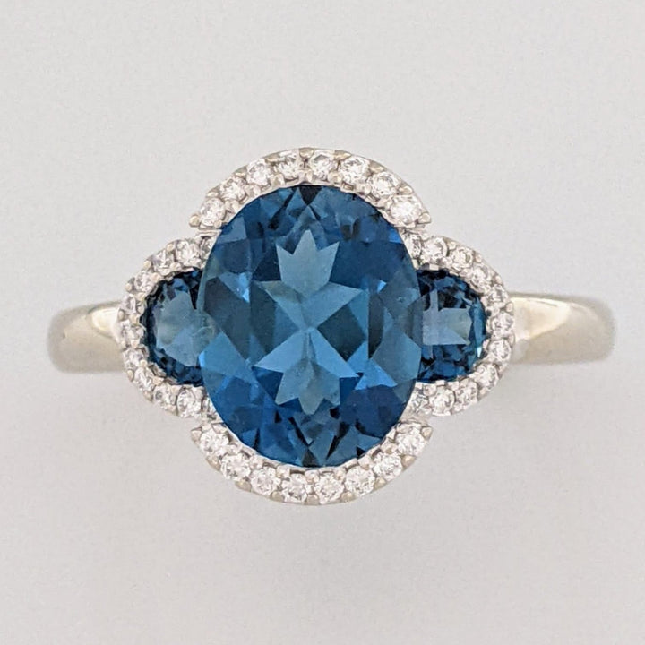 14K WHITE LONDON BLUE TOPAZ OVAL 8X10 WITH (2) TOPAZ AND .30 DIAMOND TOTAL WEIGHT ESTATE RING 4.3 GRAMS