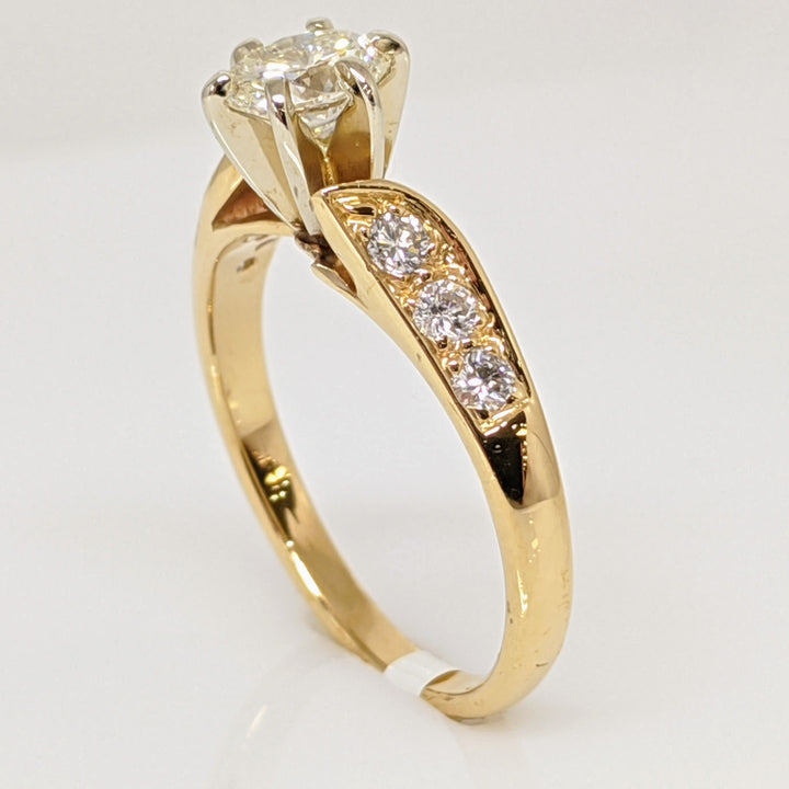 14K .62 CARAT TOTAL WEIGHT VS2 J DIAMOND OVAL WITH (6) ROUND MELEE ESTATE RING