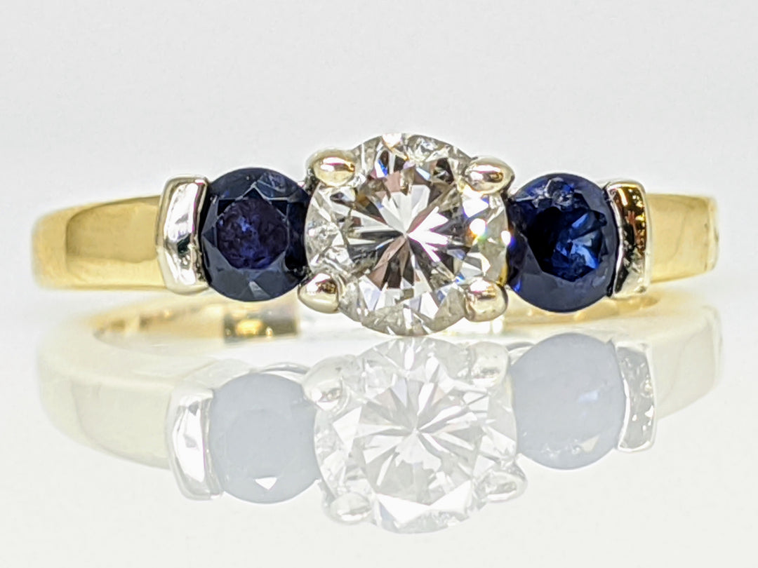 14K .55 CARAT TOTAL SI3-I1 DIAMOND ROUND AND (2) ROUND SAPPHIRE 3.5MM TRINITY ESTATE RING