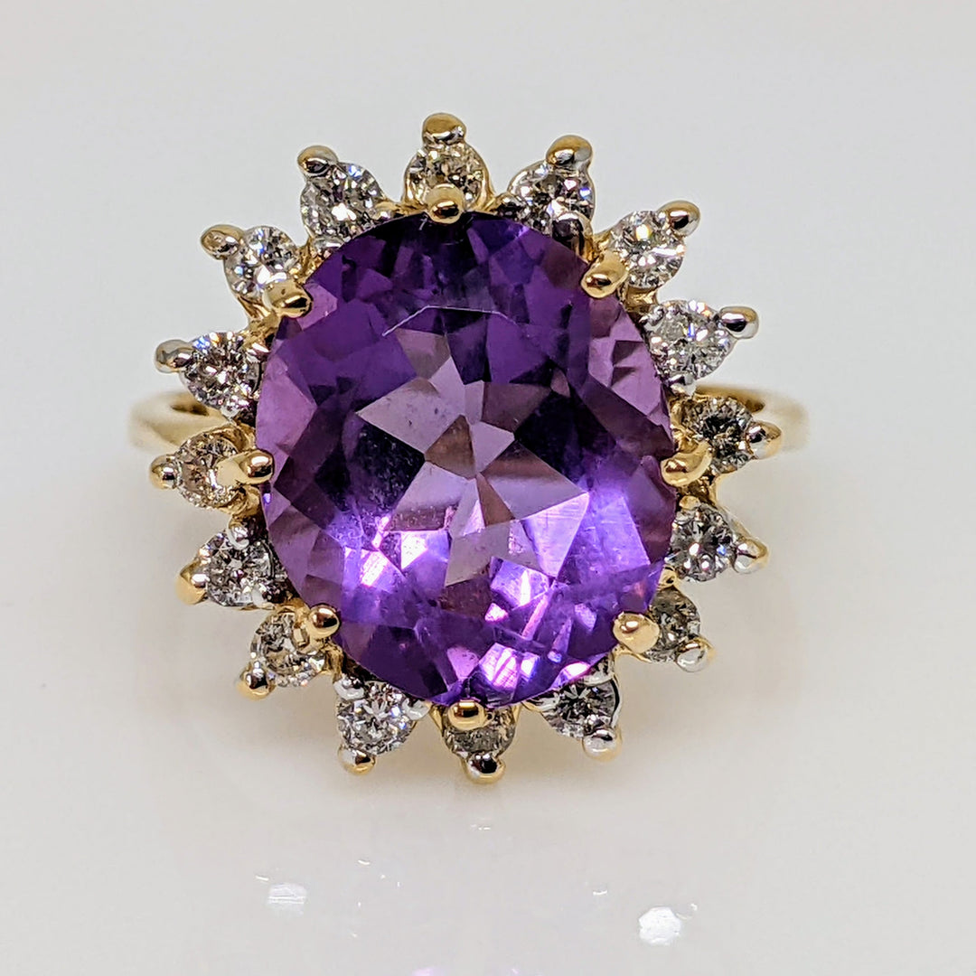 14K AMETHYST OVAL 10X12 WITH (16) ROUND .48 CARAT TOTAL WEIGHT ESTATE RING 4.7 GRAMS