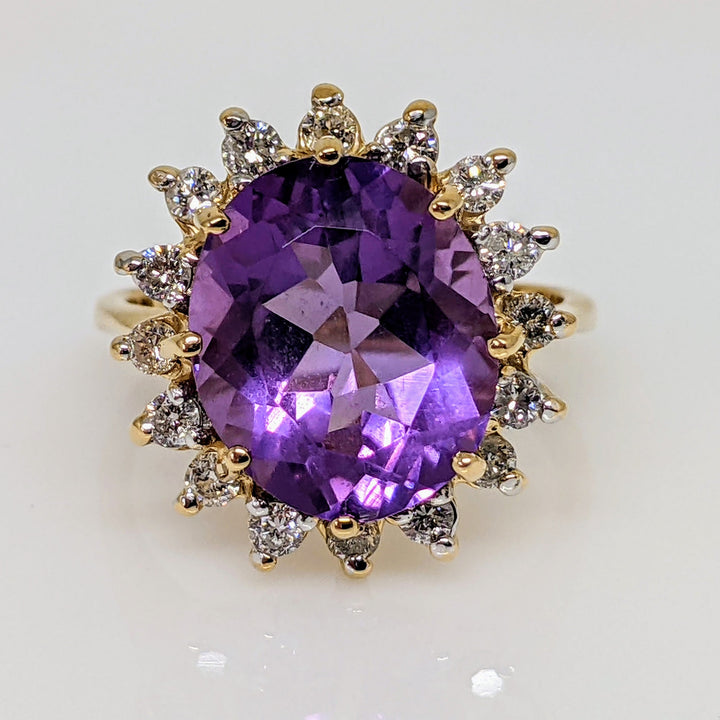 14K AMETHYST OVAL 10X12 WITH (16) ROUND .48 CARAT TOTAL WEIGHT ESTATE RING 4.7 GRAMS