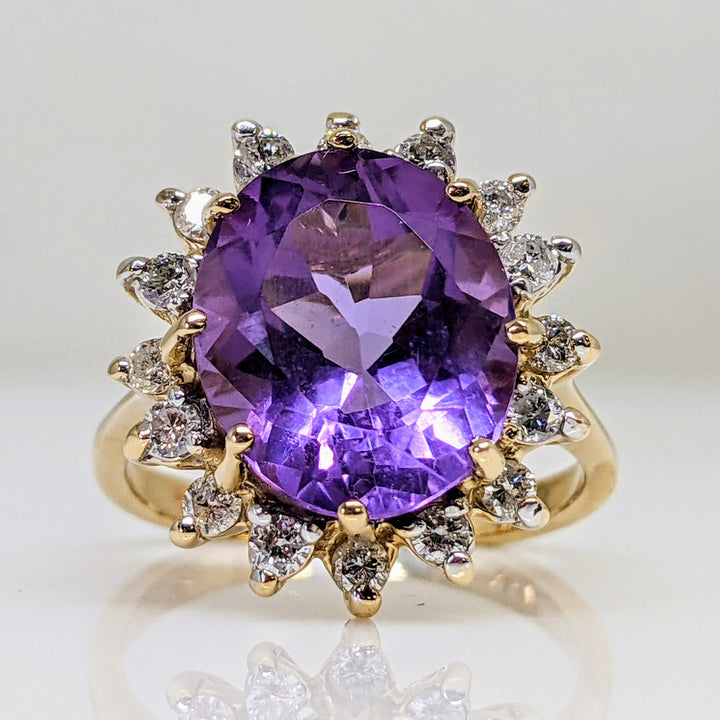 14K AMETHYST OVAL 10X12 WITH (16) ROUND .48 CARAT TOTAL WEIGHT ESTATE RING 4.7 GRAMS