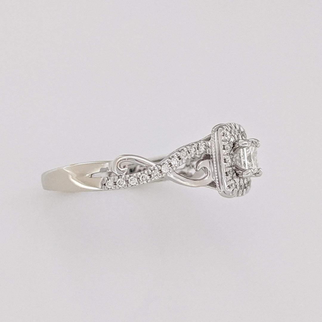 10K WHITE .48 CARAT TOTAL WEIGHT SI2 H DIAMOND PRINCESS CUT (1) ROUND (36) ESTATE HALO TWIST RING 2.8 GRAMS