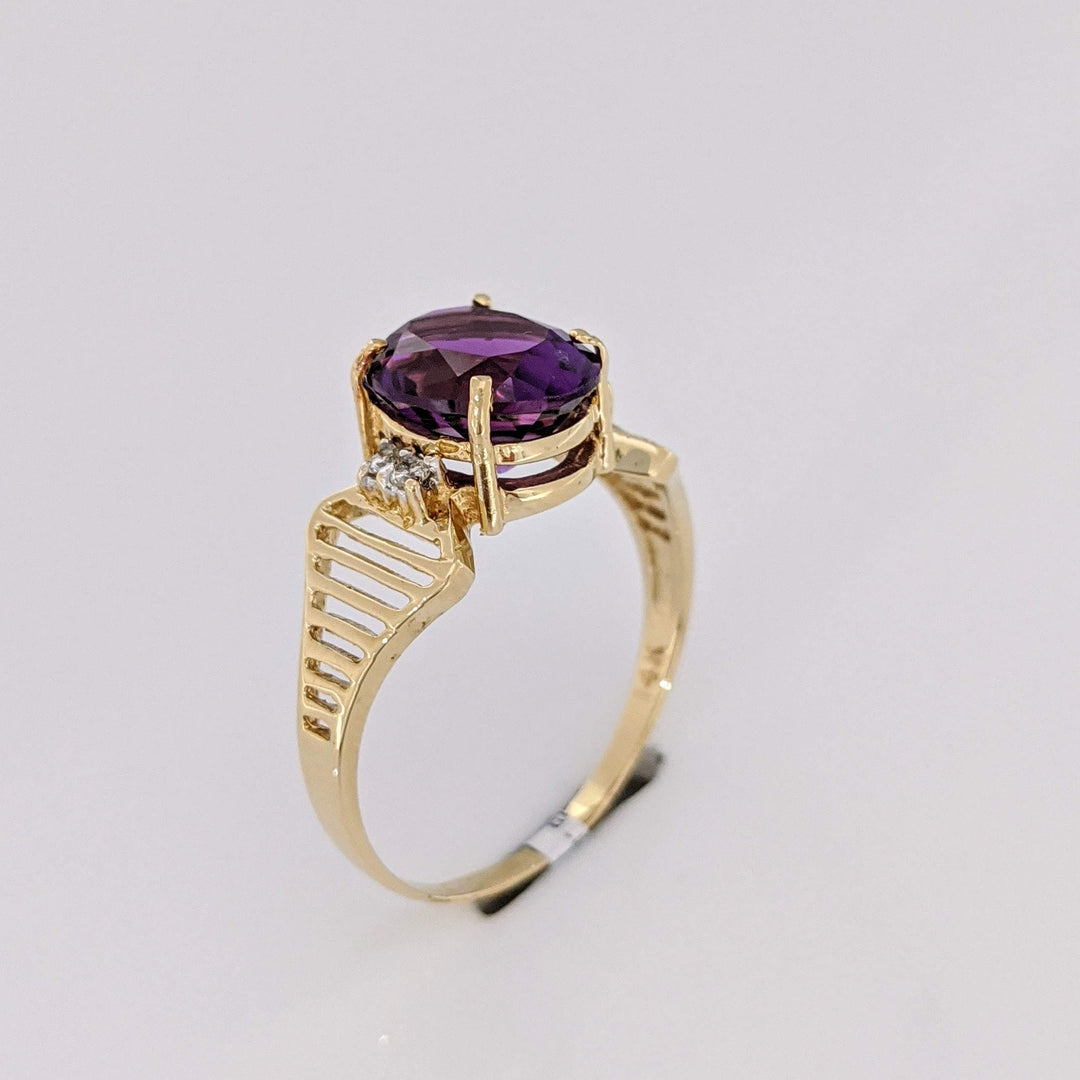 14K AMETHYST OVAL 8X10 WITH (4) MELEE OPEN LINE ESTATE RING 3.1 GRAMS