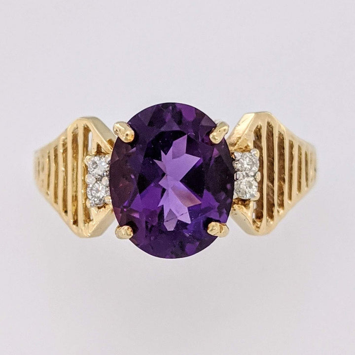 14K AMETHYST OVAL 8X10 WITH (4) MELEE OPEN LINE ESTATE RING 3.1 GRAMS