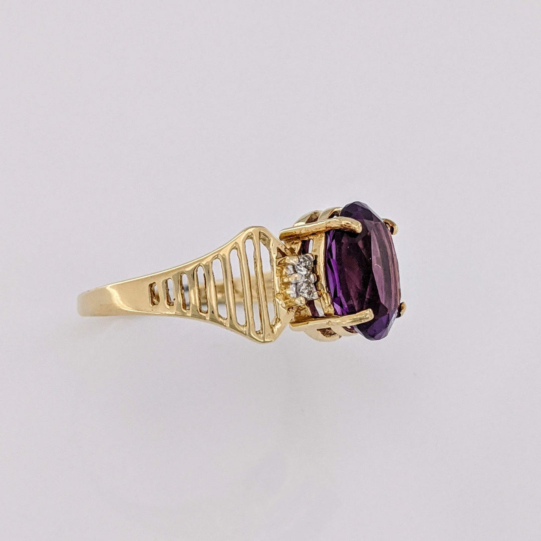 14K AMETHYST OVAL 8X10 WITH (4) MELEE OPEN LINE ESTATE RING 3.1 GRAMS