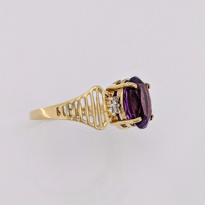 14K AMETHYST OVAL 8X10 WITH (4) MELEE OPEN LINE ESTATE RING 3.1 GRAMS