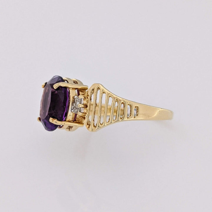 14K AMETHYST OVAL 8X10 WITH (4) MELEE OPEN LINE ESTATE RING 3.1 GRAMS
