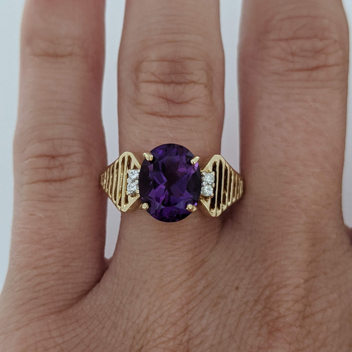 14K AMETHYST OVAL 8X10 WITH (4) MELEE OPEN LINE ESTATE RING 3.1 GRAMS