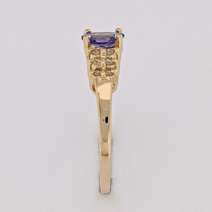 14K TANZANITE OVAL 4X6 WITH (12) MELEE ESTATE RING 2.2 GRAMS