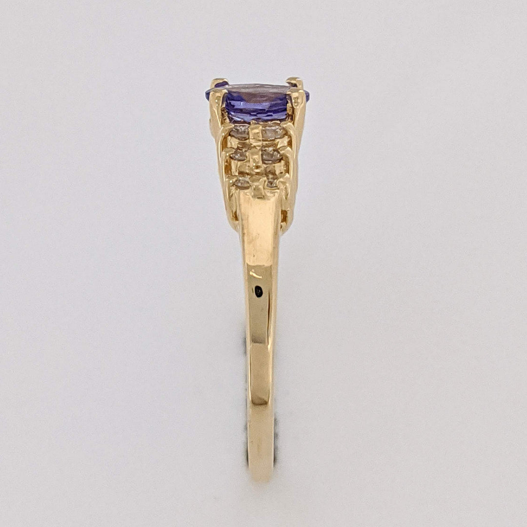 14K TANZANITE OVAL 4X6 WITH (12) MELEE ESTATE RING 2.2 GRAMS
