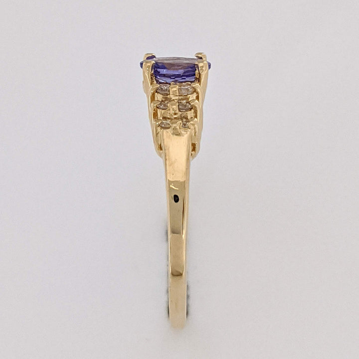 14K TANZANITE OVAL 4X6 WITH (12) MELEE ESTATE RING 2.2 GRAMS