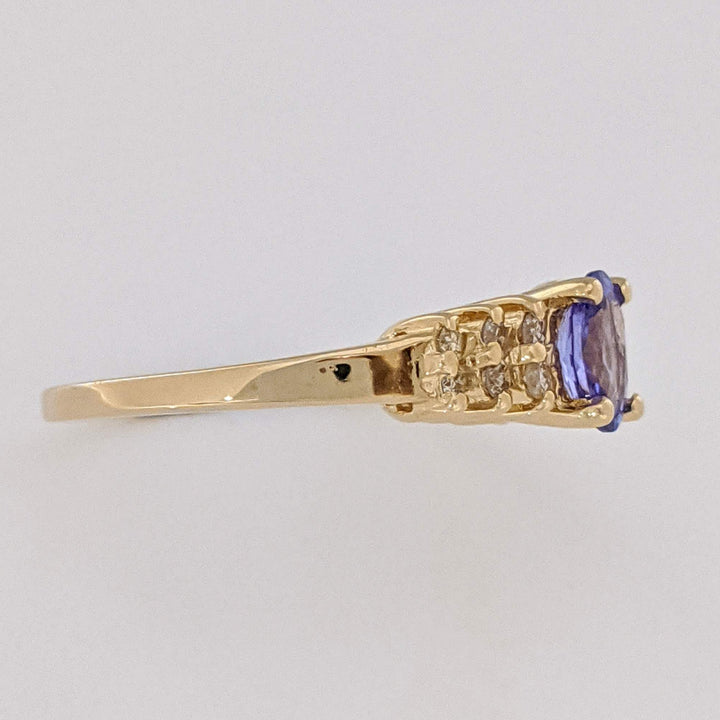 14K TANZANITE OVAL 4X6 WITH (12) MELEE ESTATE RING 2.2 GRAMS