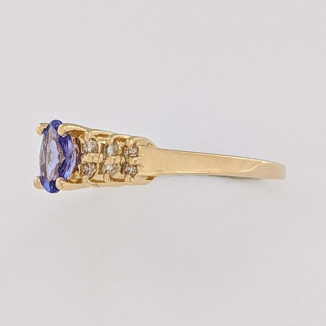 14K TANZANITE OVAL 4X6 WITH (12) MELEE ESTATE RING 2.2 GRAMS