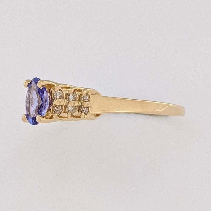 14K TANZANITE OVAL 4X6 WITH (12) MELEE ESTATE RING 2.2 GRAMS
