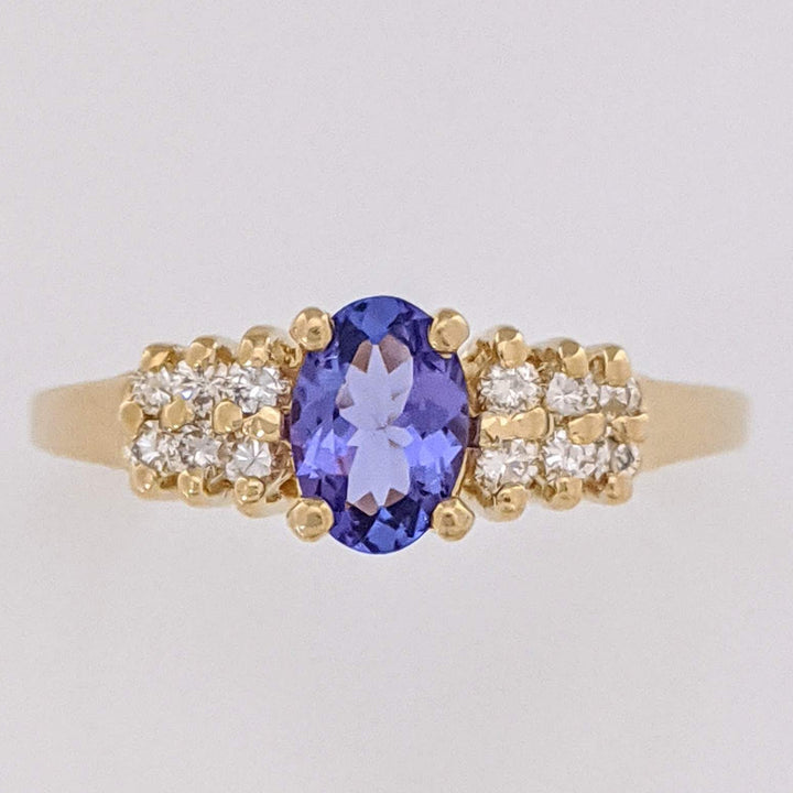 14K TANZANITE OVAL 4X6 WITH (12) MELEE ESTATE RING 2.2 GRAMS