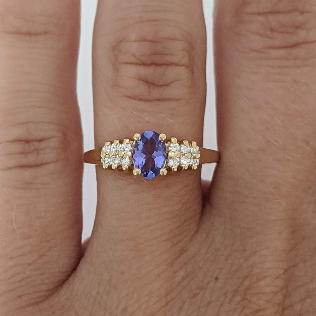 14K TANZANITE OVAL 4X6 WITH (12) MELEE ESTATE RING 2.2 GRAMS