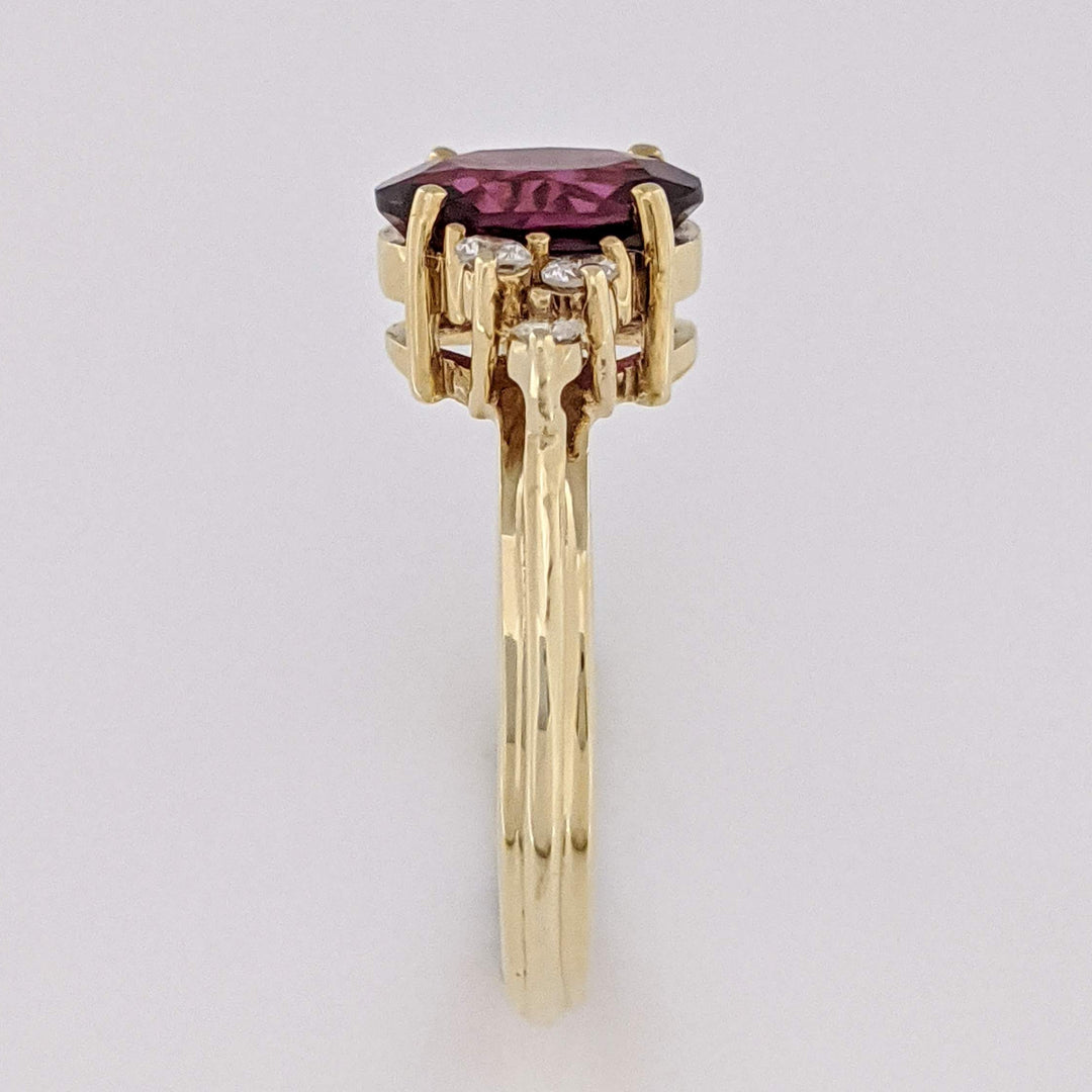 14K DEEP PINK TOURMALINE OVAL 7X9 WITH .25 DIAMOND TOTAL WEIGHT (6) ROUND ESTATE RING 4.1 GRAMS