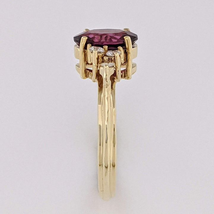 14K DEEP PINK TOURMALINE OVAL 7X9 WITH .25 DIAMOND TOTAL WEIGHT (6) ROUND ESTATE RING 4.1 GRAMS