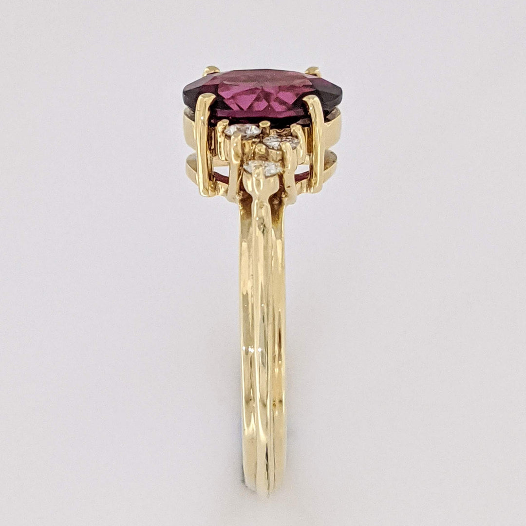 14K DEEP PINK TOURMALINE OVAL 7X9 WITH .25 DIAMOND TOTAL WEIGHT (6) ROUND ESTATE RING 4.1 GRAMS