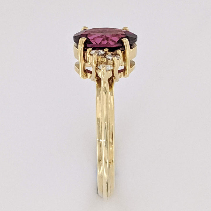 14K DEEP PINK TOURMALINE OVAL 7X9 WITH .25 DIAMOND TOTAL WEIGHT (6) ROUND ESTATE RING 4.1 GRAMS