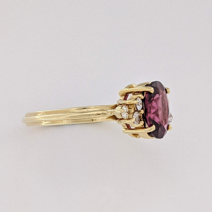 14K DEEP PINK TOURMALINE OVAL 7X9 WITH .25 DIAMOND TOTAL WEIGHT (6) ROUND ESTATE RING 4.1 GRAMS