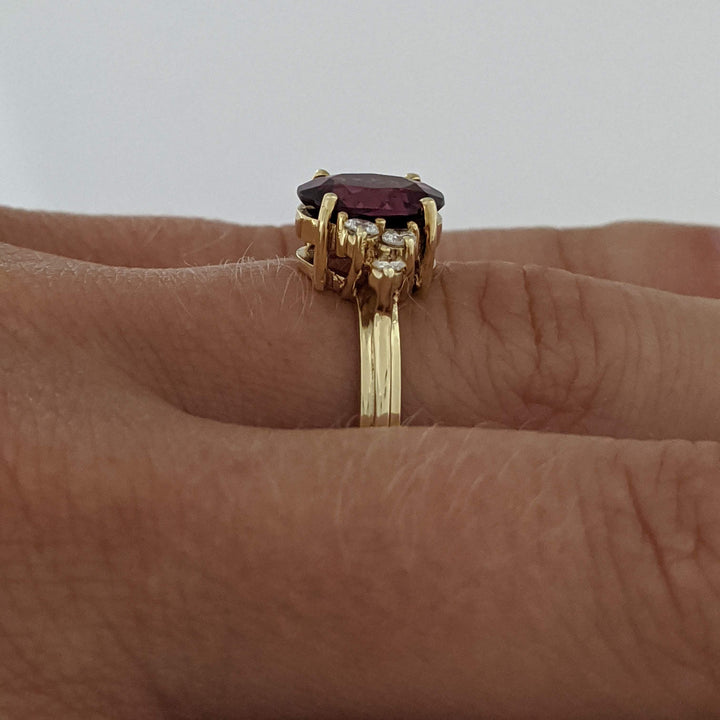 14K DEEP PINK TOURMALINE OVAL 7X9 WITH .25 DIAMOND TOTAL WEIGHT (6) ROUND ESTATE RING 4.1 GRAMS