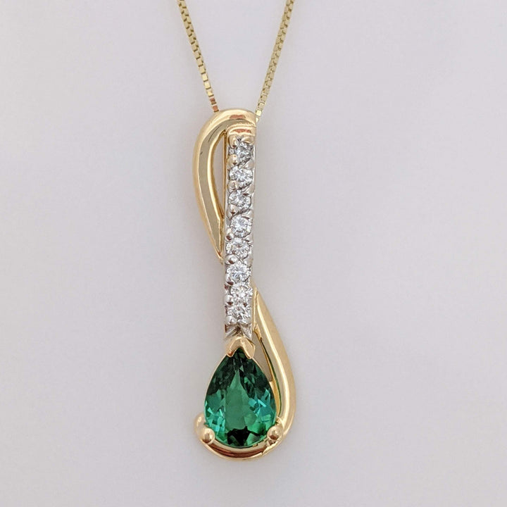 14K GREEN TOURMALINE PEAR 5X7 WITH .12 DIAMOND TOTAL WEIGHT (8) ESTATE PENDANT & CHAIN 2.9 GRAMS