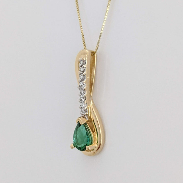 14K GREEN TOURMALINE PEAR 5X7 WITH .12 DIAMOND TOTAL WEIGHT (8) ESTATE PENDANT & CHAIN 2.9 GRAMS