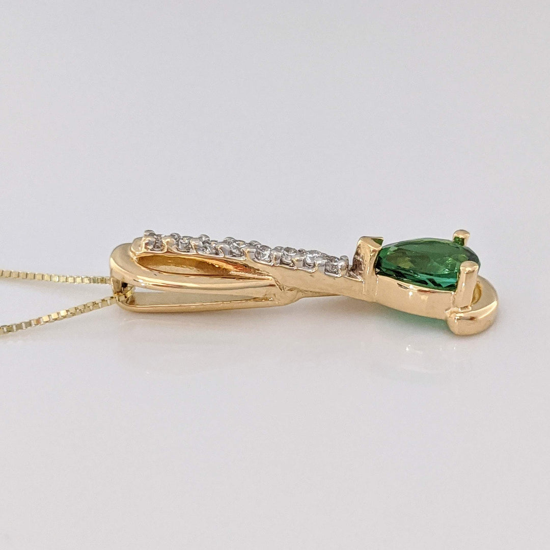14K GREEN TOURMALINE PEAR 5X7 WITH .12 DIAMOND TOTAL WEIGHT (8) ESTATE PENDANT & CHAIN 2.9 GRAMS
