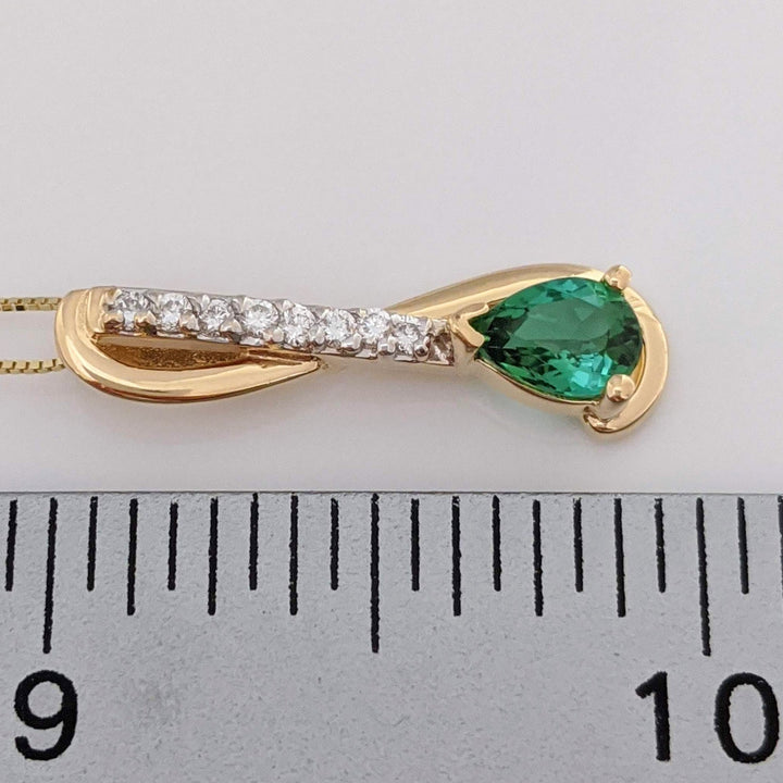 14K GREEN TOURMALINE PEAR 5X7 WITH .12 DIAMOND TOTAL WEIGHT (8) ESTATE PENDANT & CHAIN 2.9 GRAMS