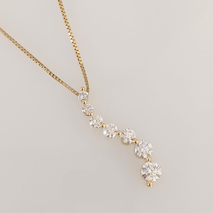 14k .80 CARAT TOTAL WEIGHT I1 G DIAMOND ROUND (7) ESTATE JOURNEY PENDANT & CHAIN 2.8 GRAMS