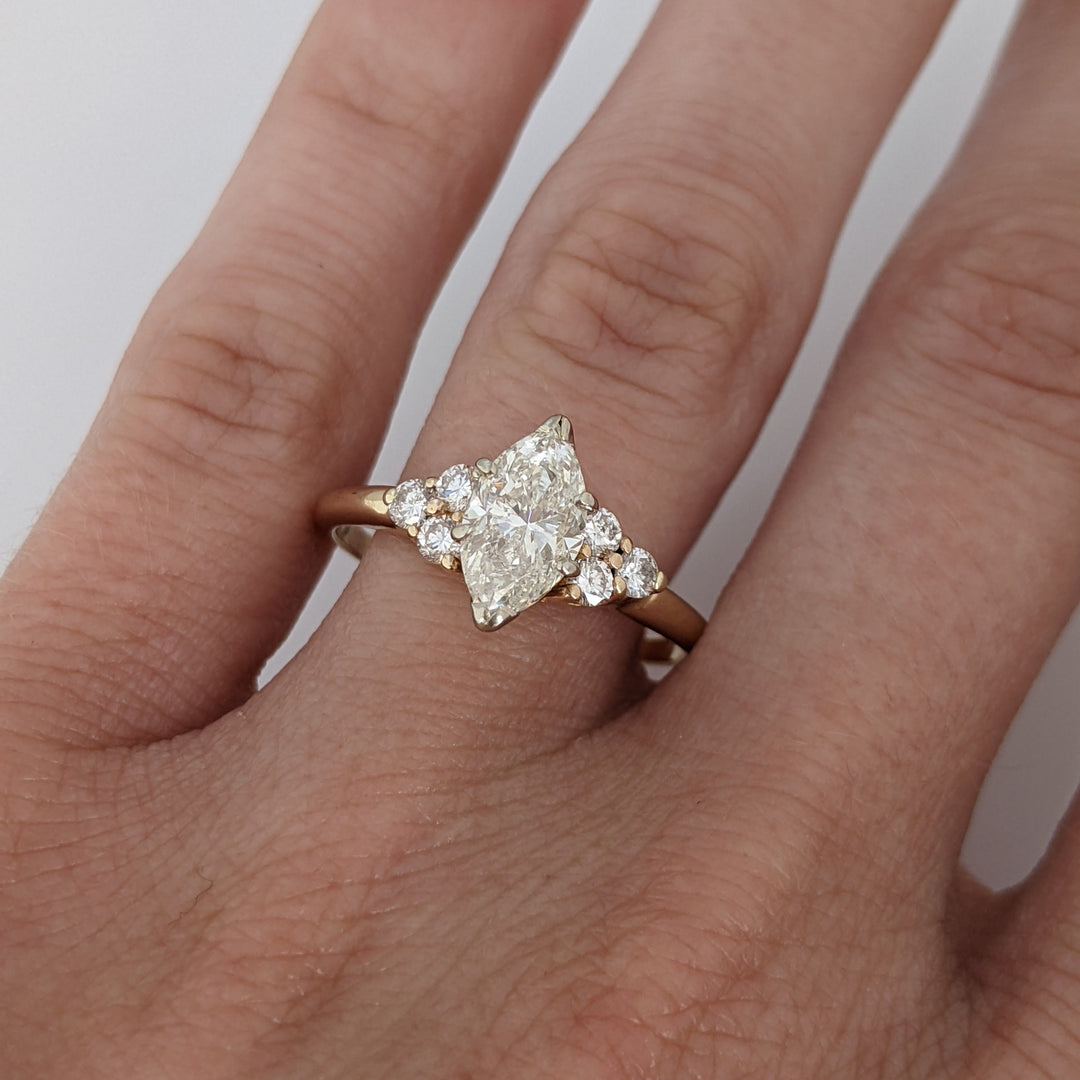 14K 1.36 CARAT TOTAL WEIGHT I1 K DIAMOND MARQUISE WITH (6) ROUND MELEE ESTATE RING 3.0 GRAMS