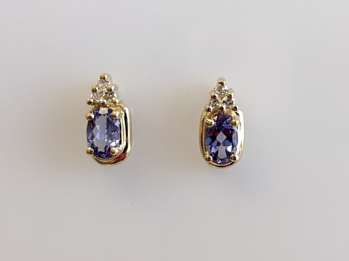 14K TANZANITE OVAL 4X6 WITH (6) DIAMONDS ESTATE STUD EARRINGS 2.2 GRAMS