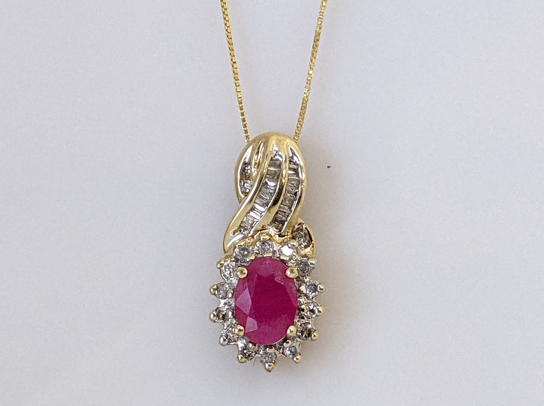10K RUBY OVAL 5X7 WITH ROUND AND BAGUETTE .26 DIAMOND TOTAL WEIGHT 2.6 GRAMS  PENDANT AND CHAIN