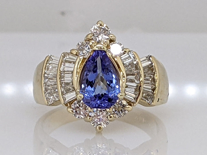 14K TANZANITE PEAR WITH 1.00 CARAT TOTAL WEIGHT WITH (6) ROUNDS 6.6 GRAM RING