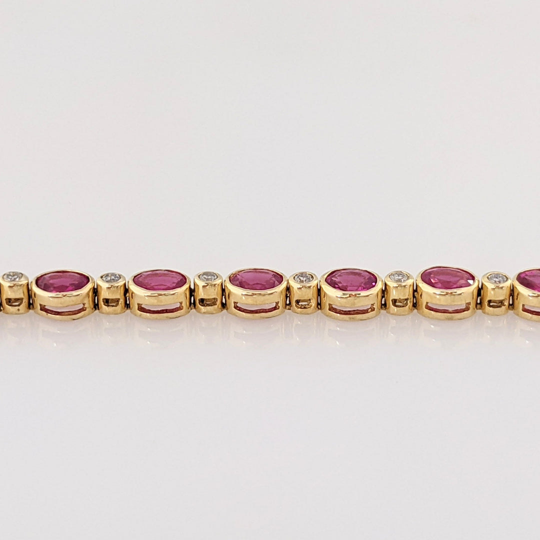 14K RUBY OVAL 3X4 (9) WITH .12 DIAMOND TOTAL WEIGHT ESTATE BRACELET 8.0 GRAMS