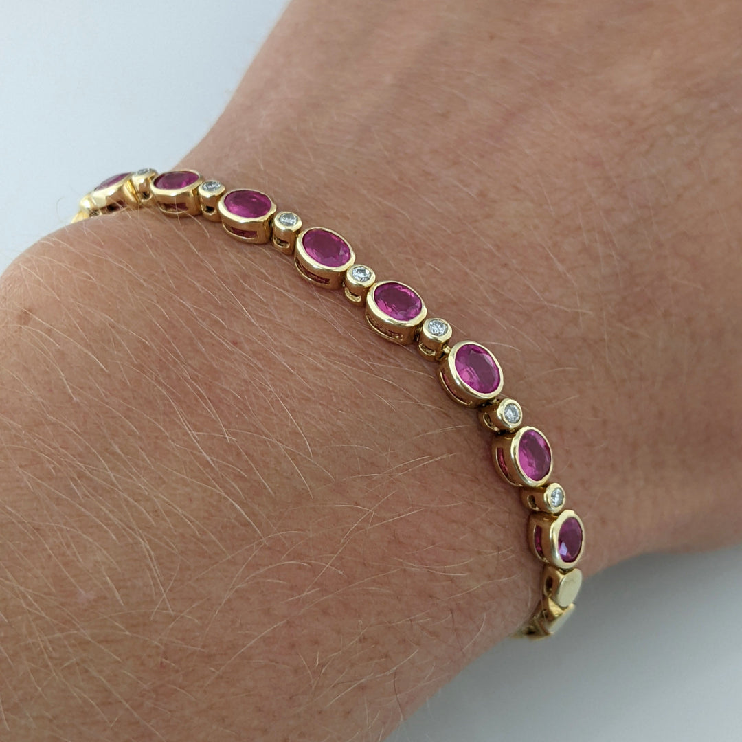 14K RUBY OVAL 3X4 (9) WITH .12 DIAMOND TOTAL WEIGHT ESTATE BRACELET 8.0 GRAMS