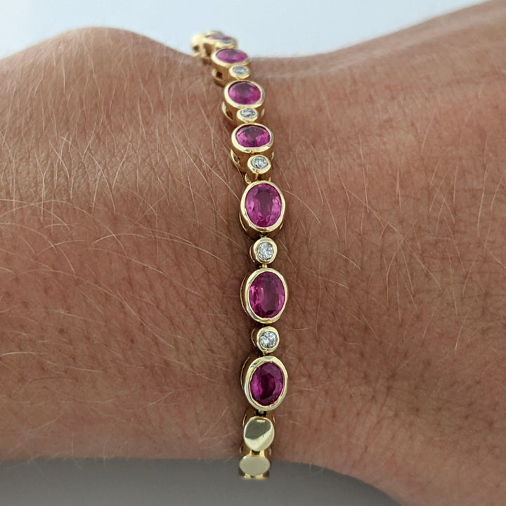 14K RUBY OVAL 3X4 (9) WITH .12 DIAMOND TOTAL WEIGHT ESTATE BRACELET 8.0 GRAMS