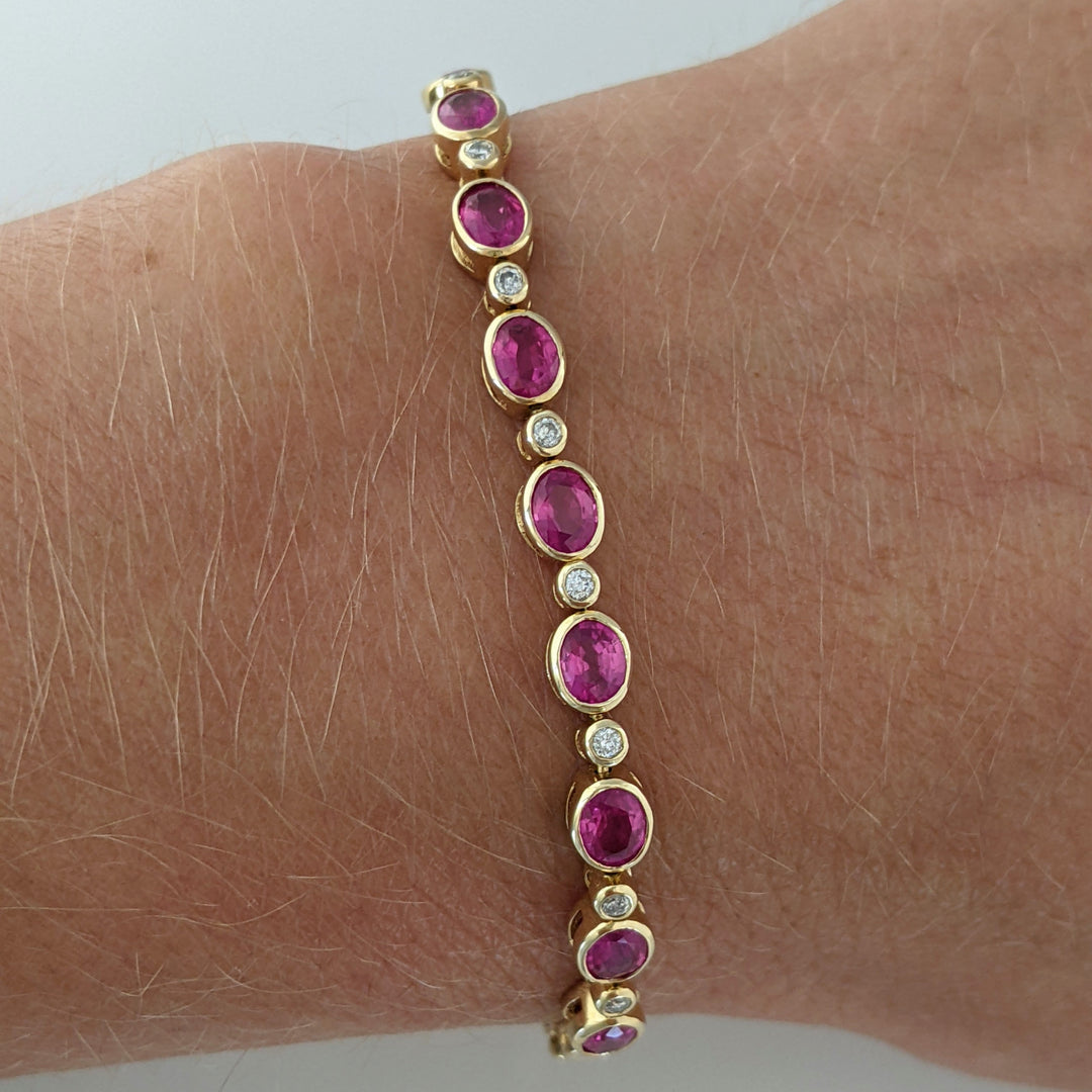 14K RUBY OVAL 3X4 (9) WITH .12 DIAMOND TOTAL WEIGHT ESTATE BRACELET 8.0 GRAMS