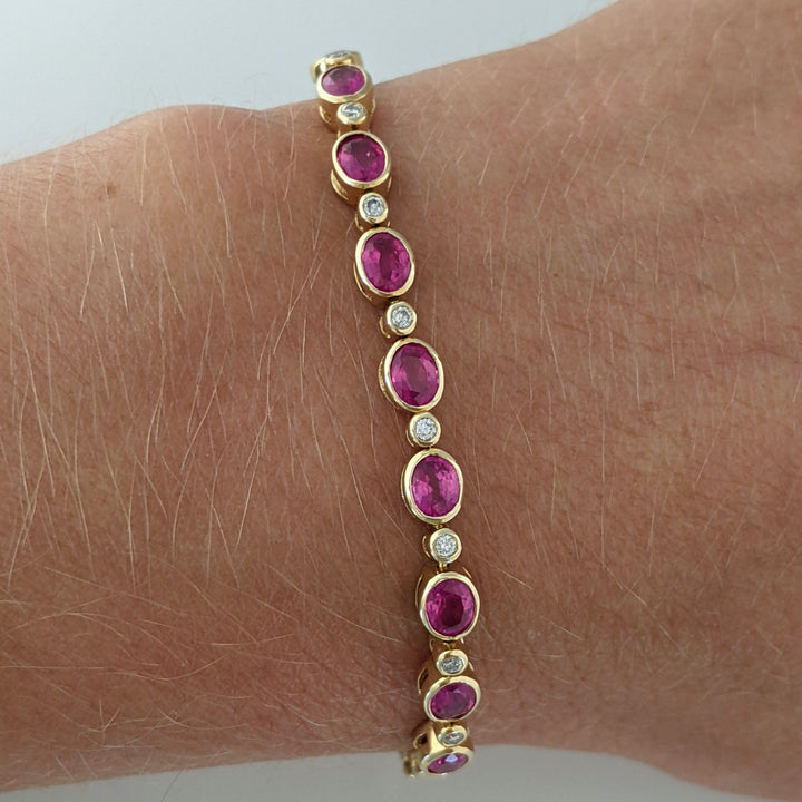 14K RUBY OVAL 3X4 (9) WITH .12 DIAMOND TOTAL WEIGHT ESTATE BRACELET 8.0 GRAMS
