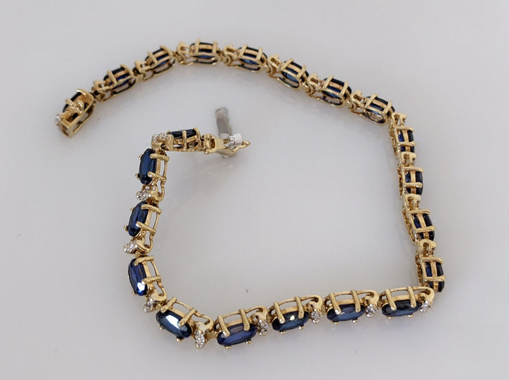 10K SYNTHETIC SAPPHIRE OVAL 4X6 (21) WITH MELEE ESTATE BRACELET 9.1 GRAMS